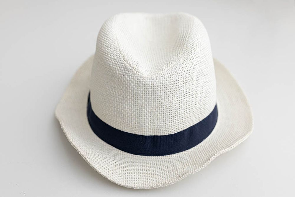 Baby boys white woven straw fedora hat with navy blue band for kids.