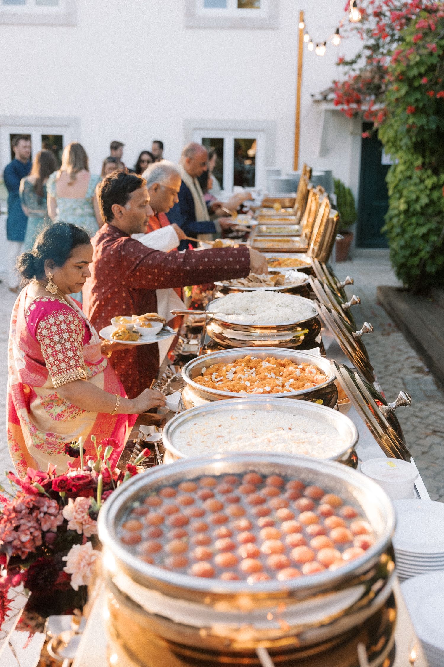 guests serving themselves at Indian wedding buffet in Portugal