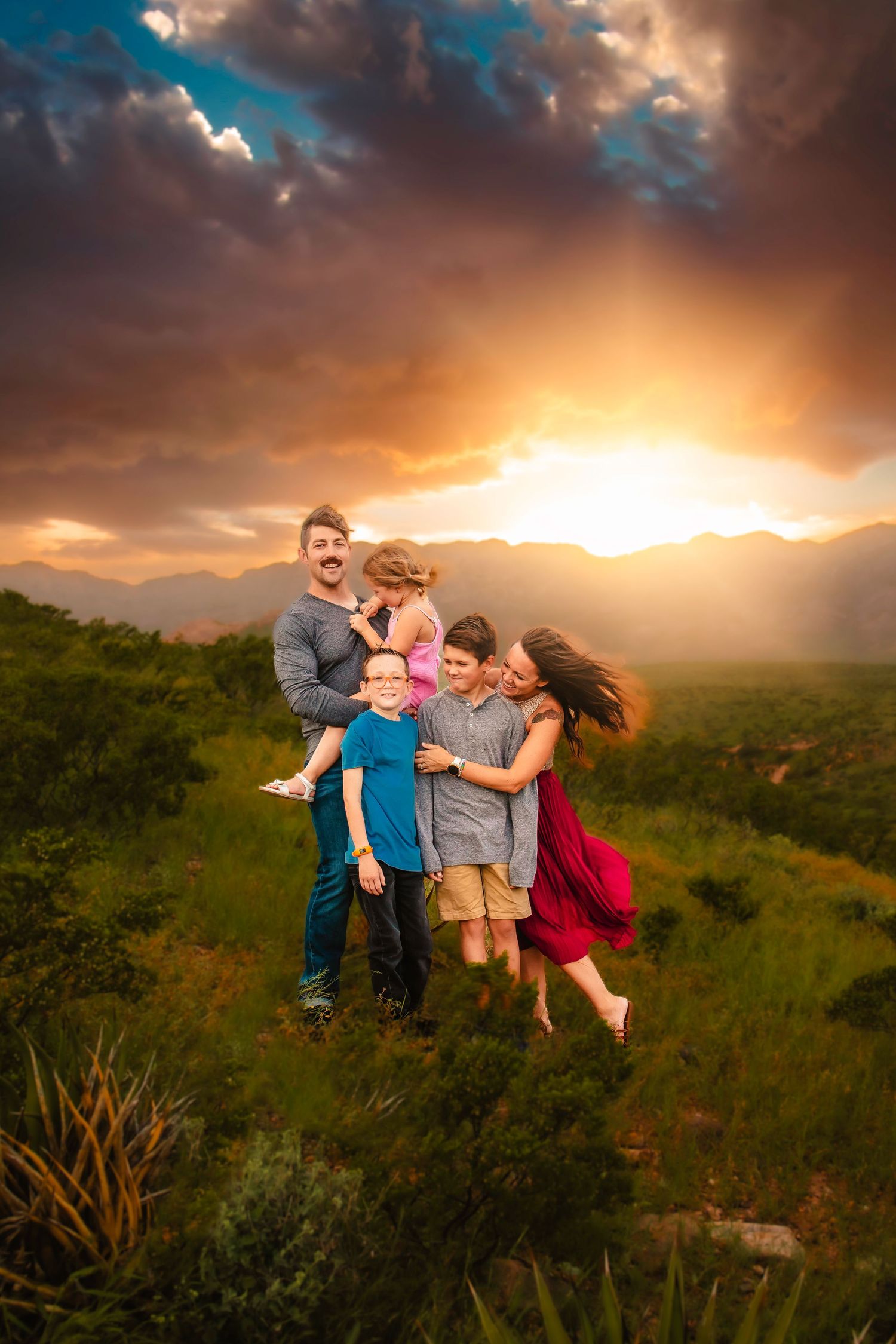 Clarksville TN family photographer capturing family in warm golden hour light with earth tones and natural connection