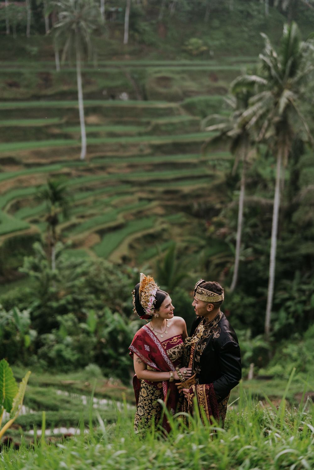 Prewedding photoshoot in Bali with Balinese costume at rice terrace and Ulu Petanu Waterfall