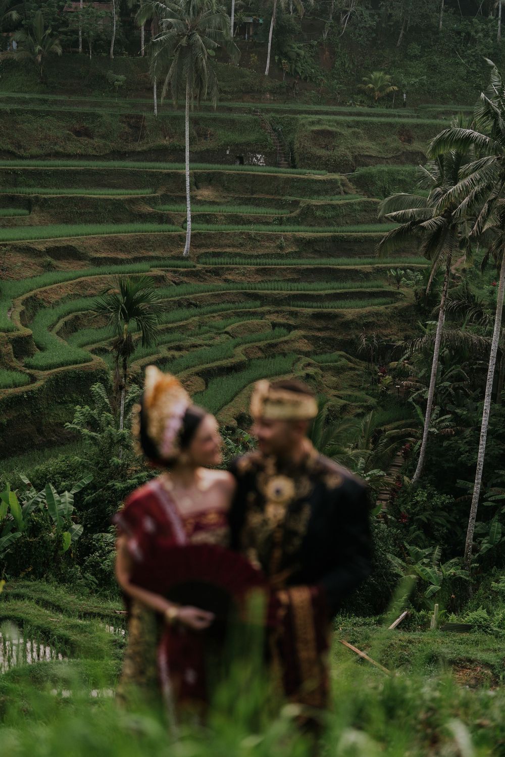 Prewedding photoshoot in Bali with Balinese costume at rice terrace and Ulu Petanu Waterfall