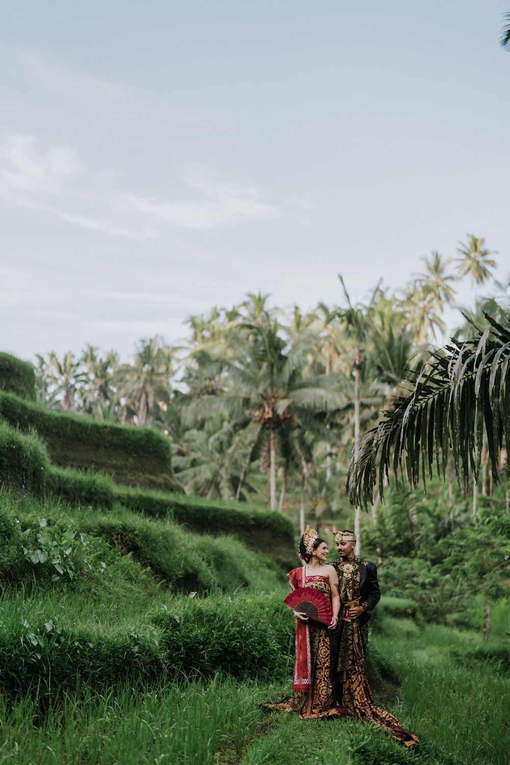 Prewedding photoshoot in Bali with Balinese costume at rice terrace and Ulu Petanu Waterfall