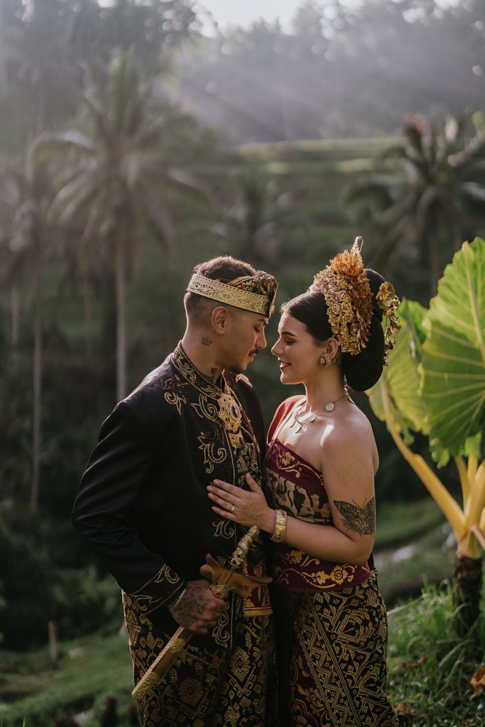 Prewedding photoshoot in Bali with Balinese costume at rice terrace and Ulu Petanu Waterfall