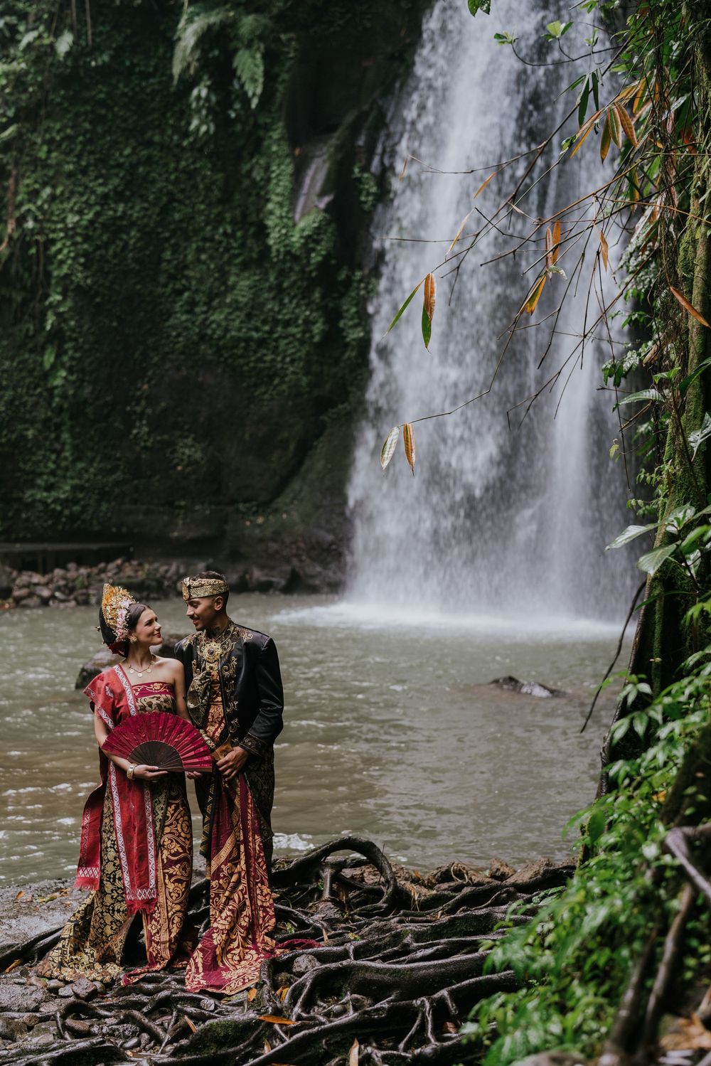 Prewedding photoshoot in Bali with Balinese costume at rice terrace and Ulu Petanu Waterfall