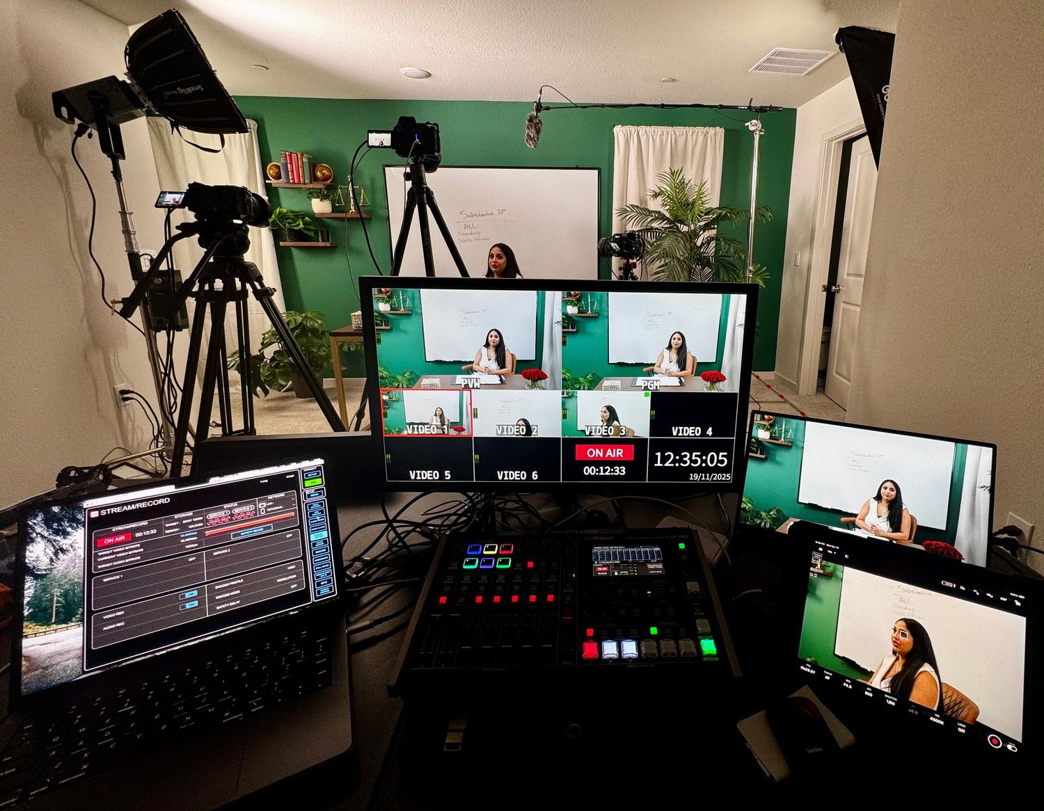 Professional video production setup showing multiple camera angles and green screen backdrop in a modern studio environment.