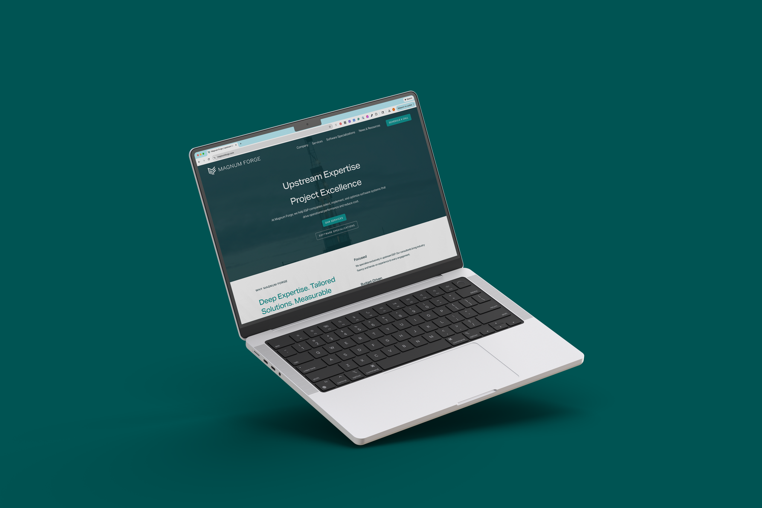 Open laptop displaying dark themed website interface on emerald green background.