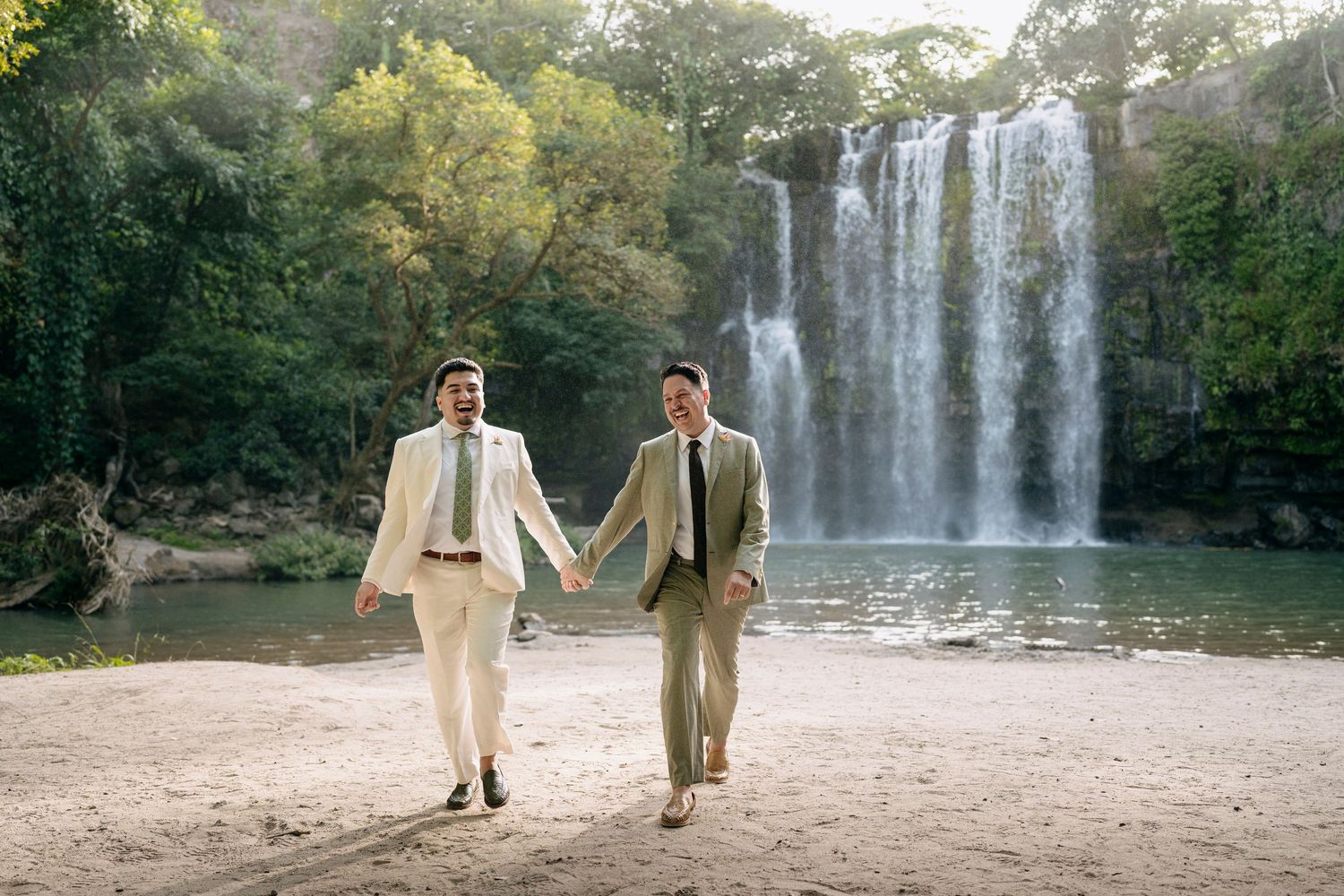 groom and groom walking after the waterfall elopement in Llanos De Cortes Waterfall