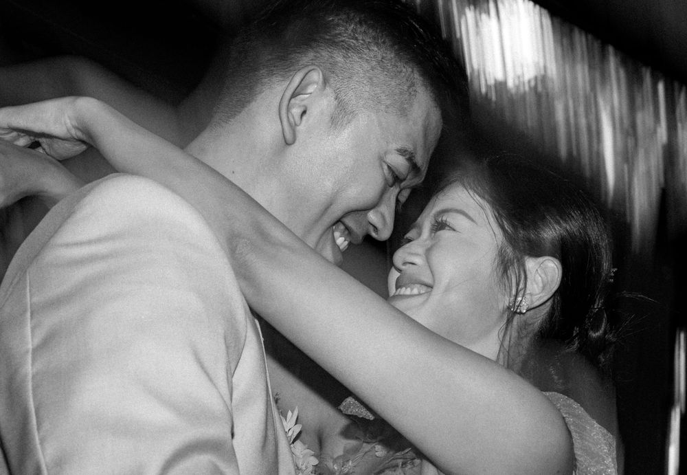 A series of black and white romantic photos showing tender moments between a couple in intimate poses.