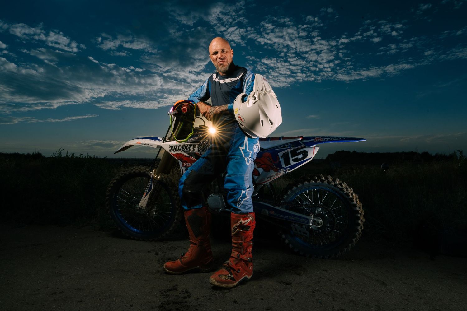 A sequence of six action shots showing a motocross rider performing stunts against a dramatic sunset sky.