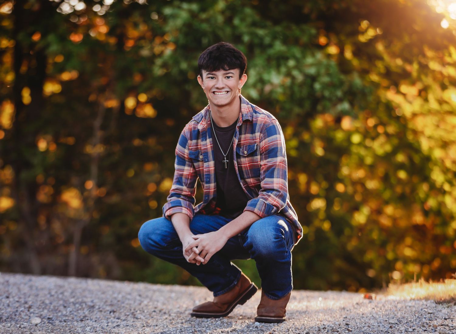 Outdoor portrait session at golden hour with autumn foliage.