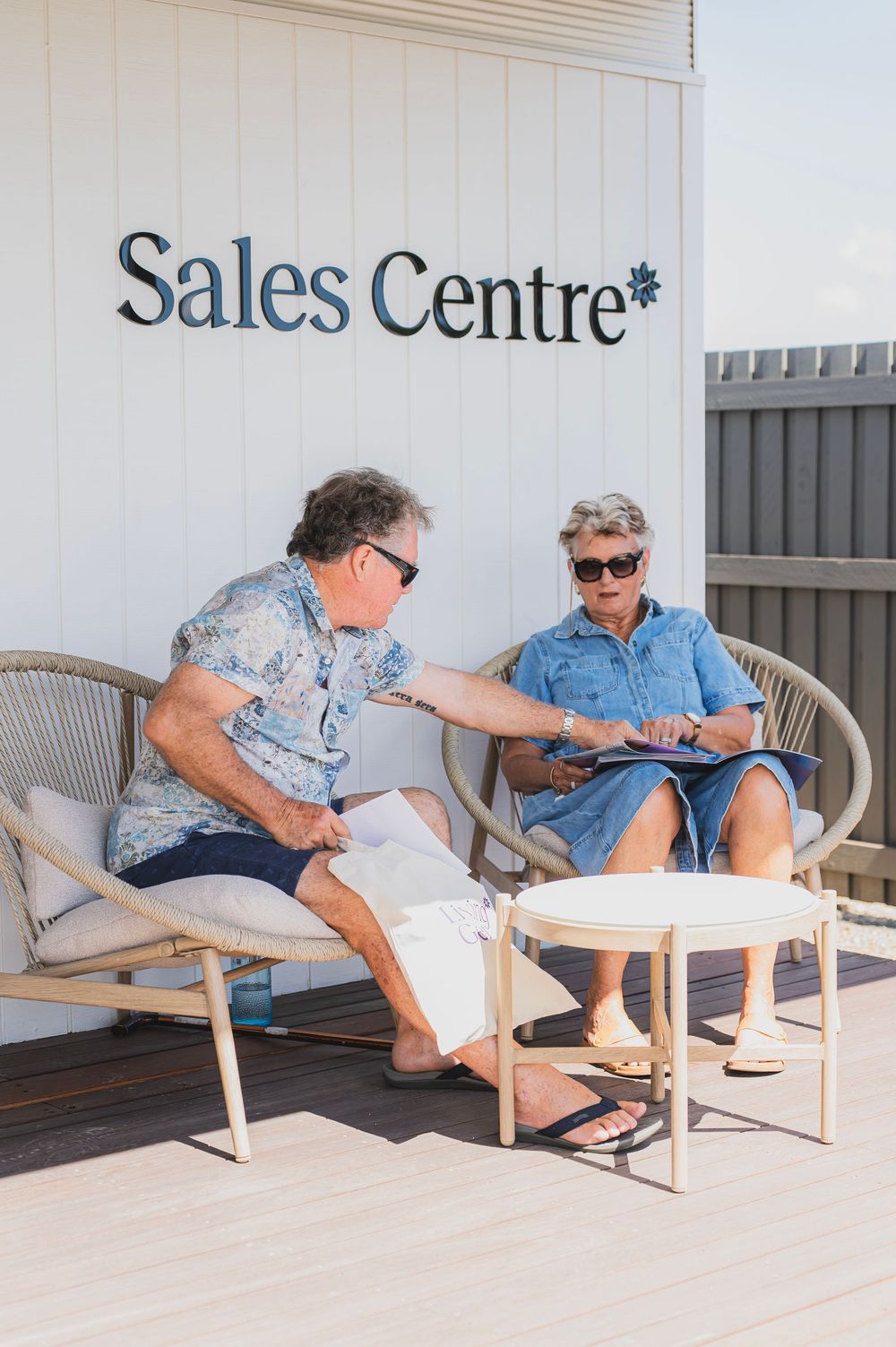 A sequence of photos showing a person in blue clothing gradually falling asleep while reading on an outdoor bench.