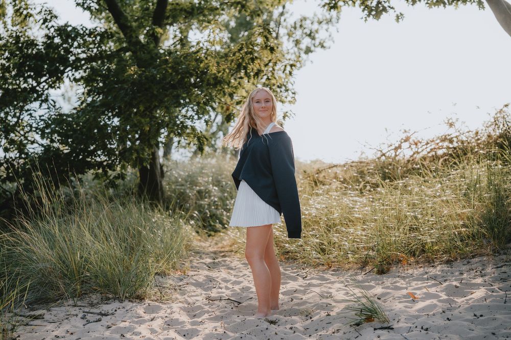 Seven scenic beach photos showing sandy paths through coastal vegetation and dunes at sunset.