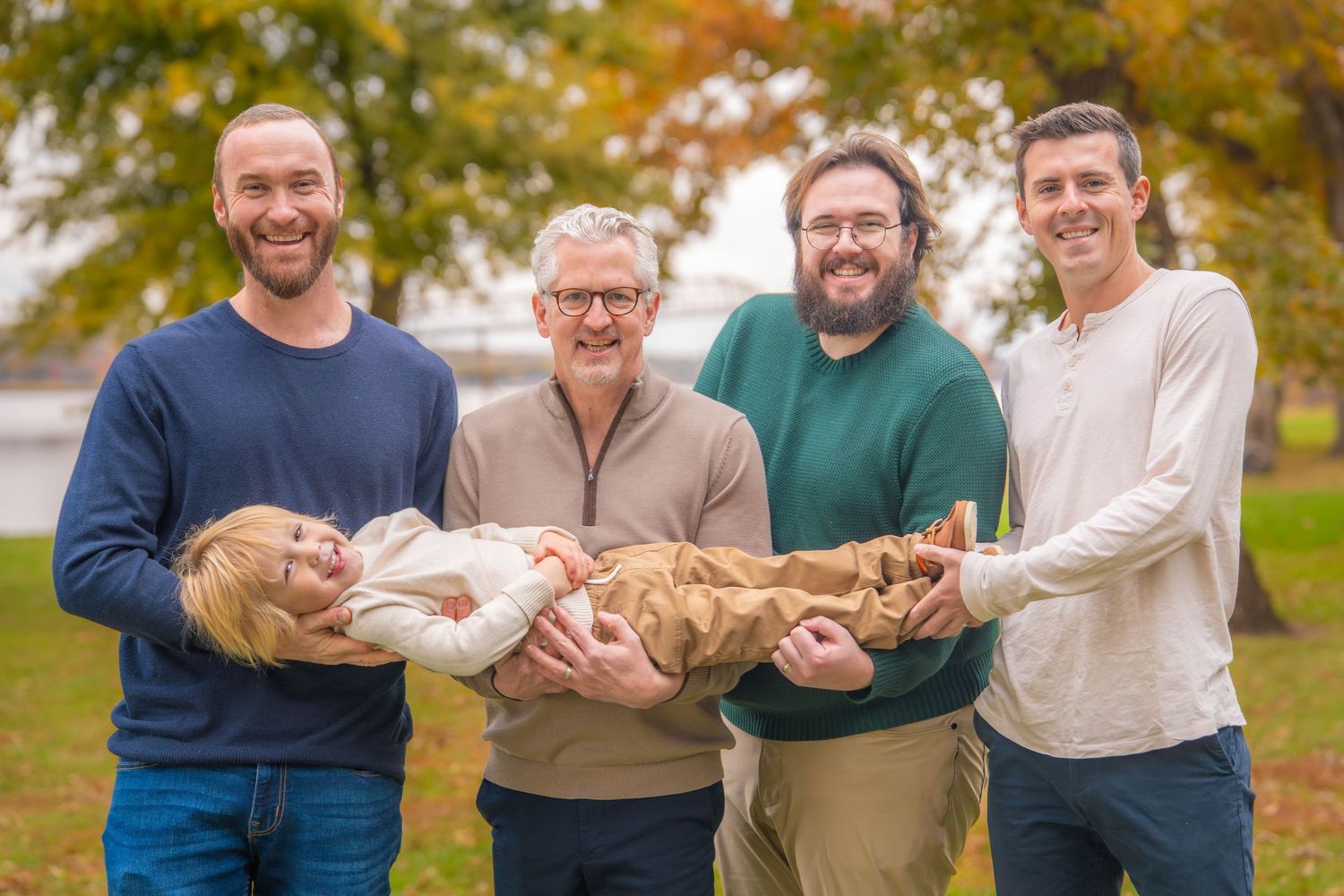Quad Cities Family Photography. A family laughing and having fun together during an autumn outdoor photo session.
