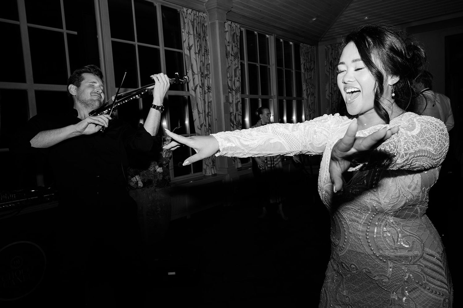 A series of monochrome photographs showing people dancing and moving in an expressive performance piece.