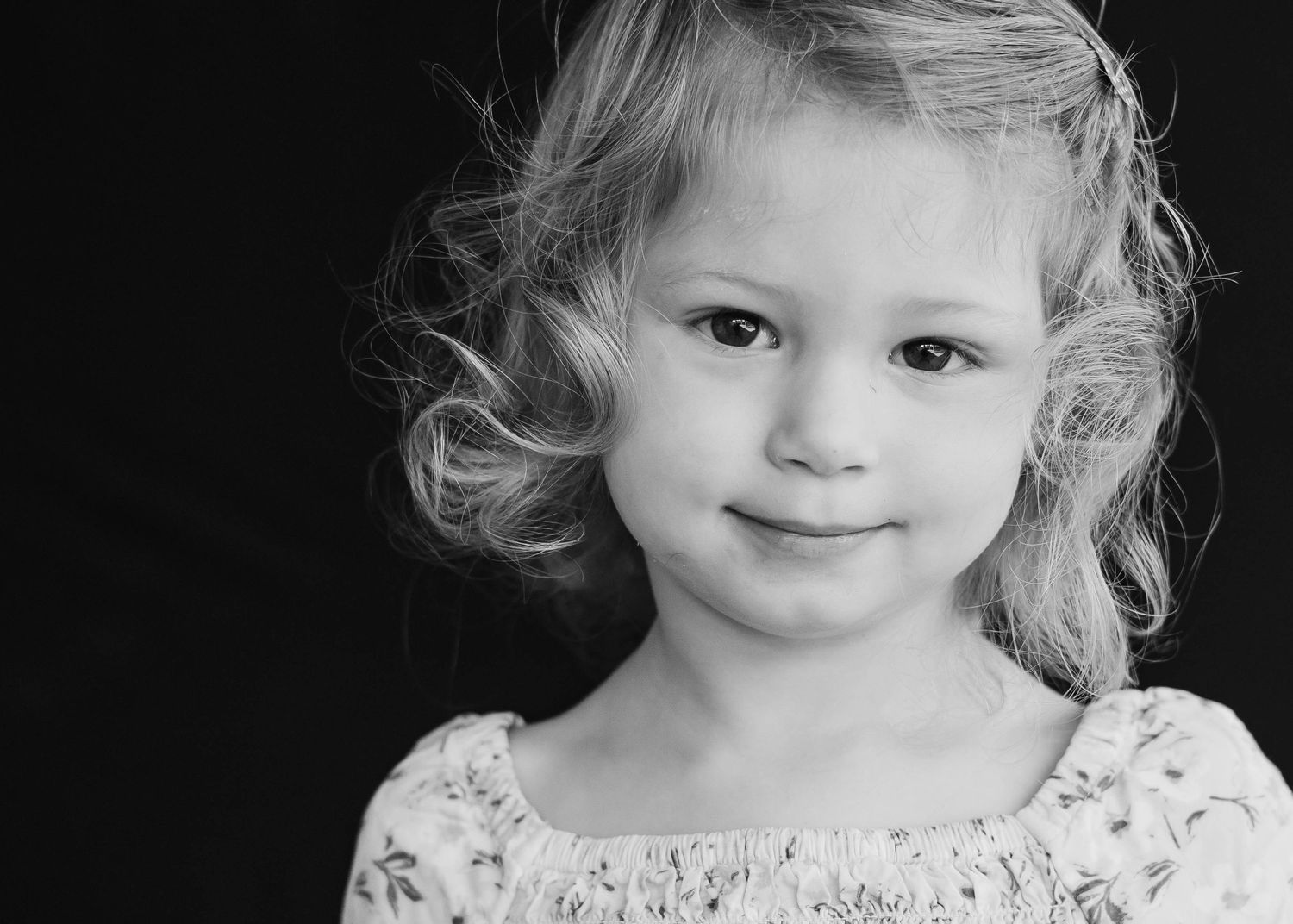 Daycare child in classic backdrop setup during fall school portraits in Brevard County.