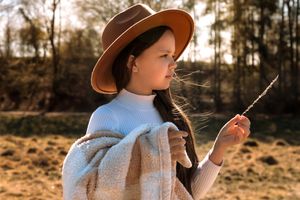 Sunset outdoor portrait series with warm golden lighting and natural scenery.