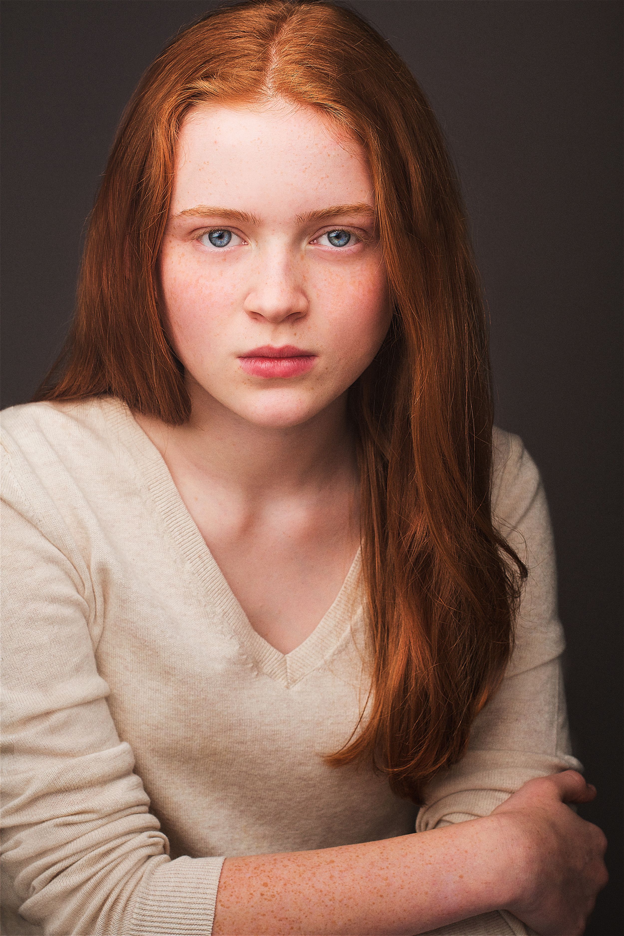 Headshot of Stranger Things actor Sadie Sink in a beige sweater.