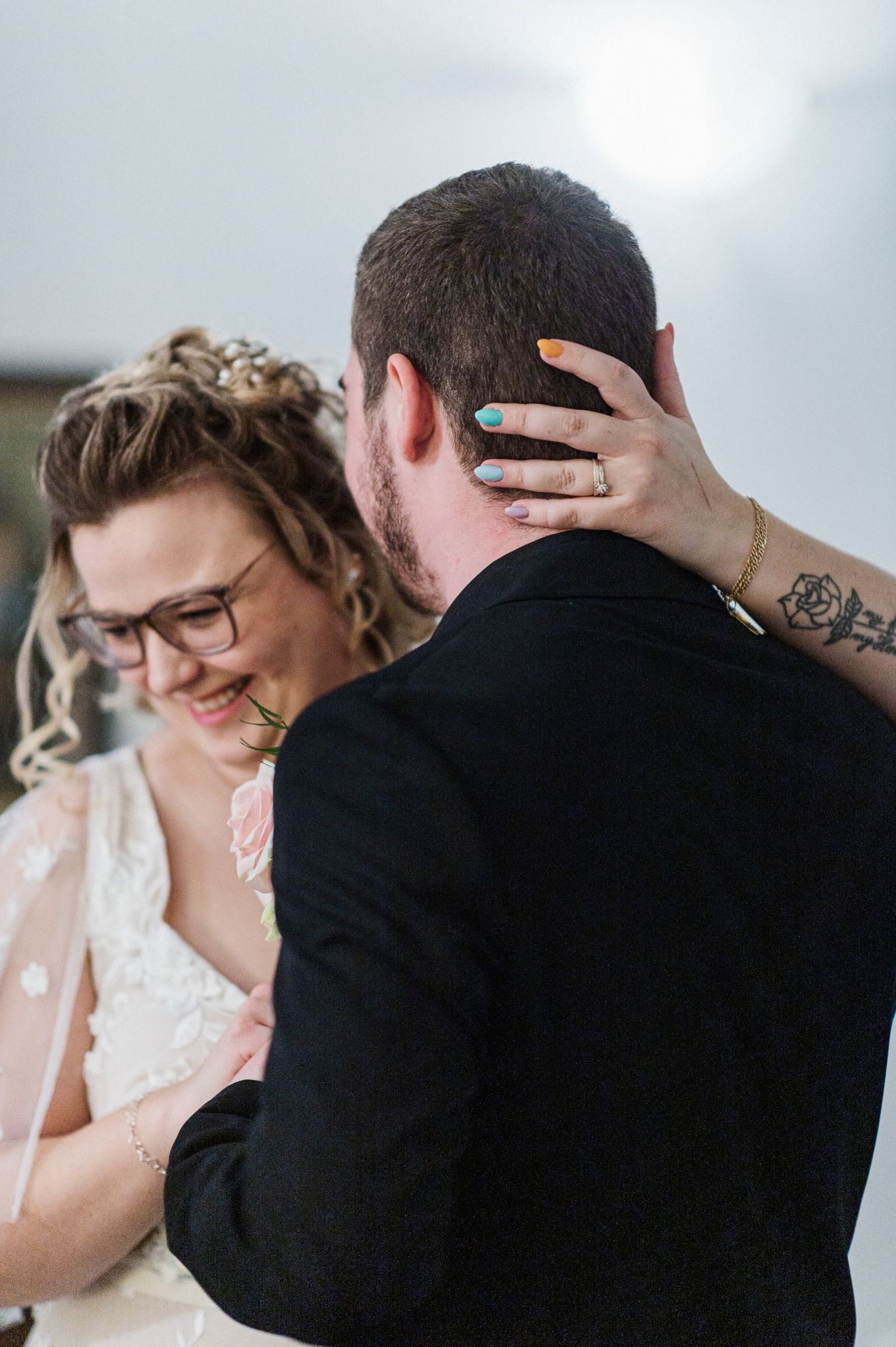 A close-up wedding photo capturing an intimate moment between newlyweds during their special day.
