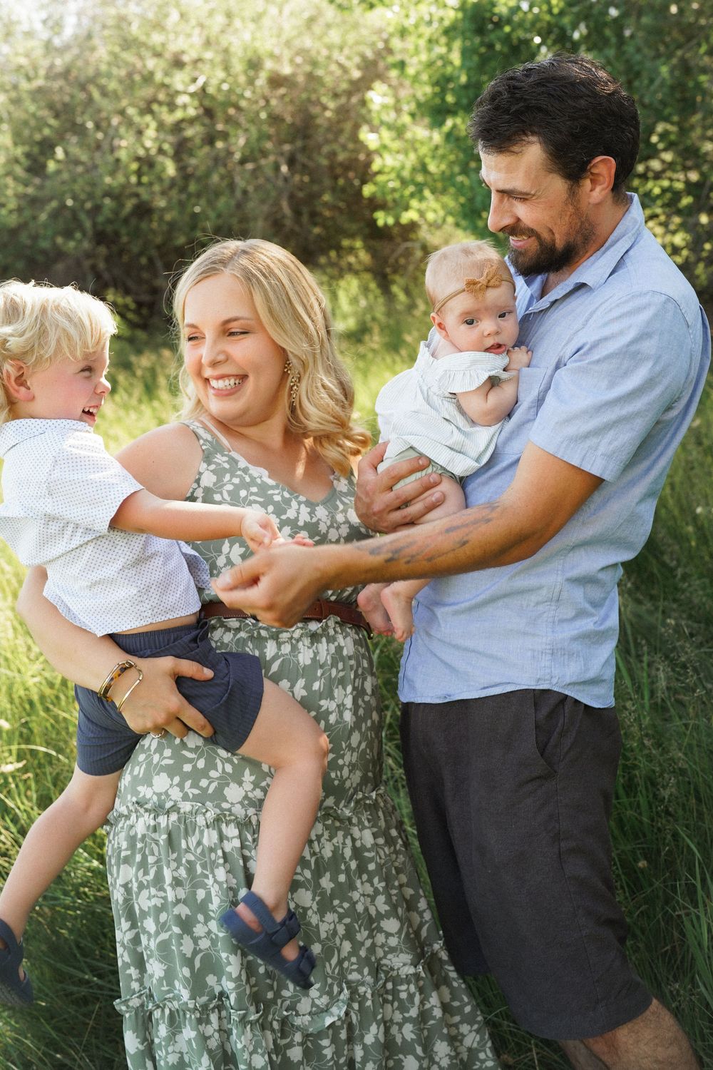 A family of three share joyful moments together outdoors in a series of candid photos showing playful interaction.
