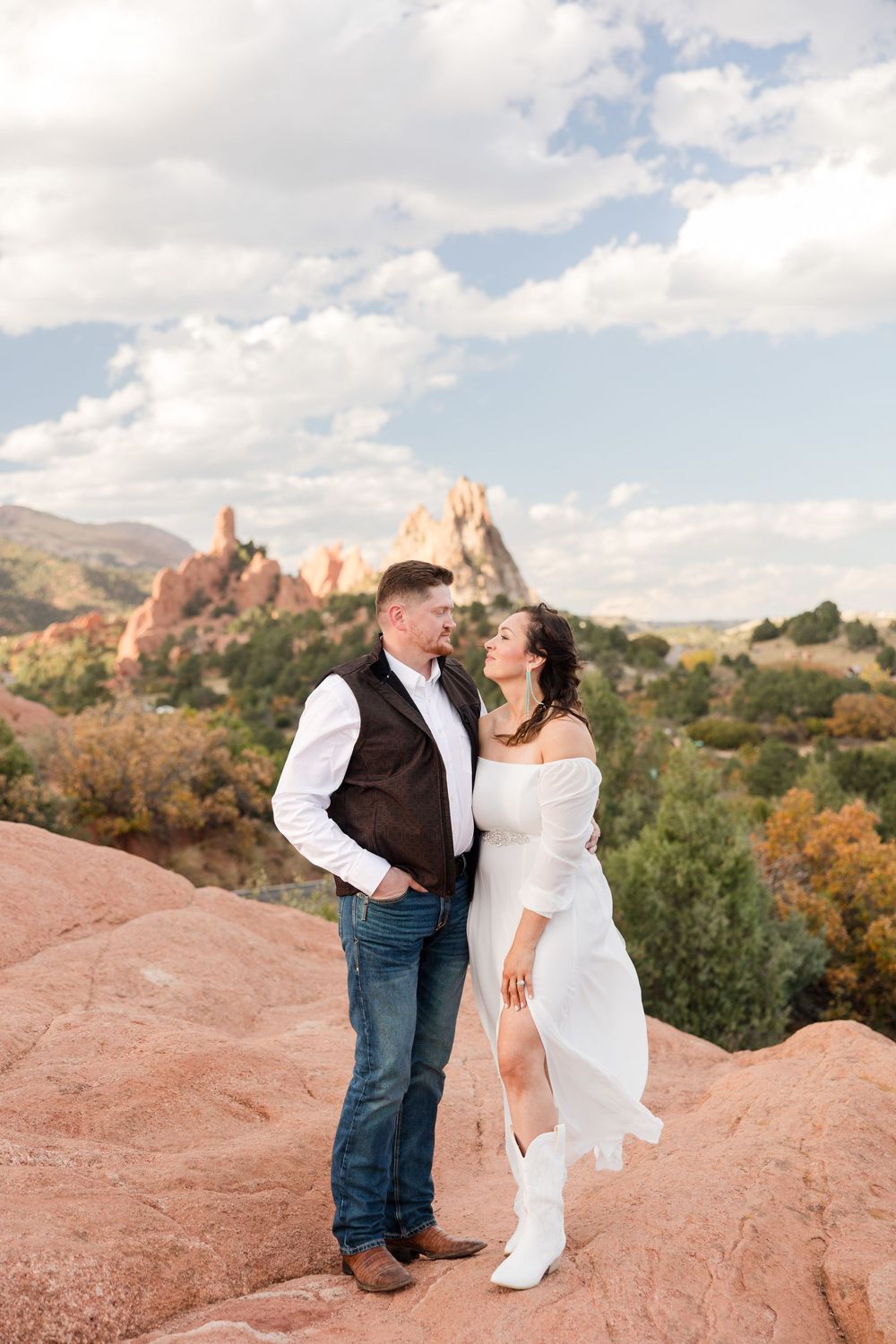 Romantic photo session on red rocks with the iconic Garden of the Gods landscape in Colorado Springs.