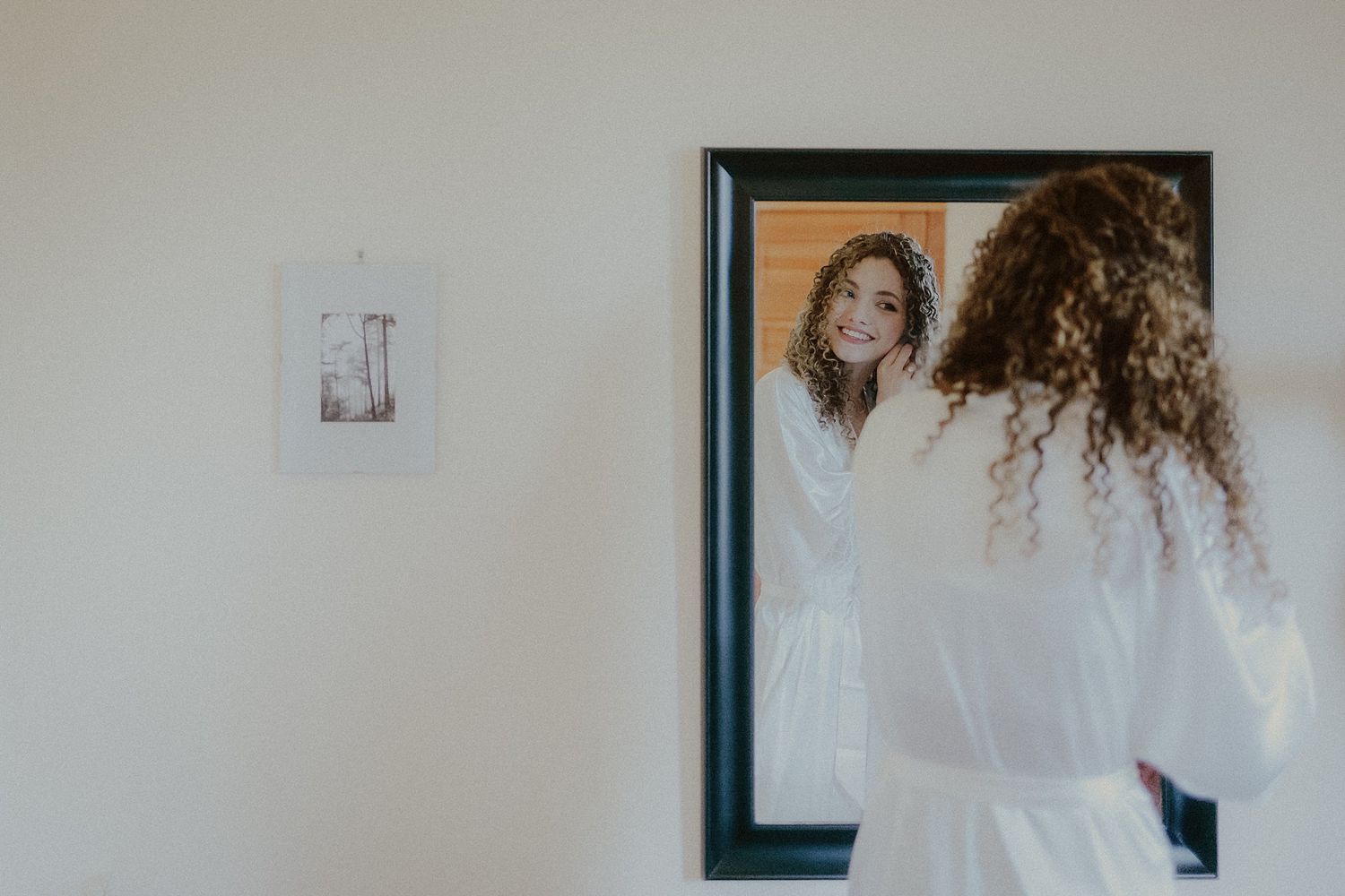 Wedding day makeup session captured in a sequence of intimate preparation moments.