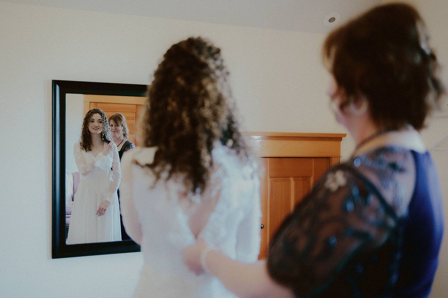 A couple gets ready in separate rooms before their wedding ceremony.