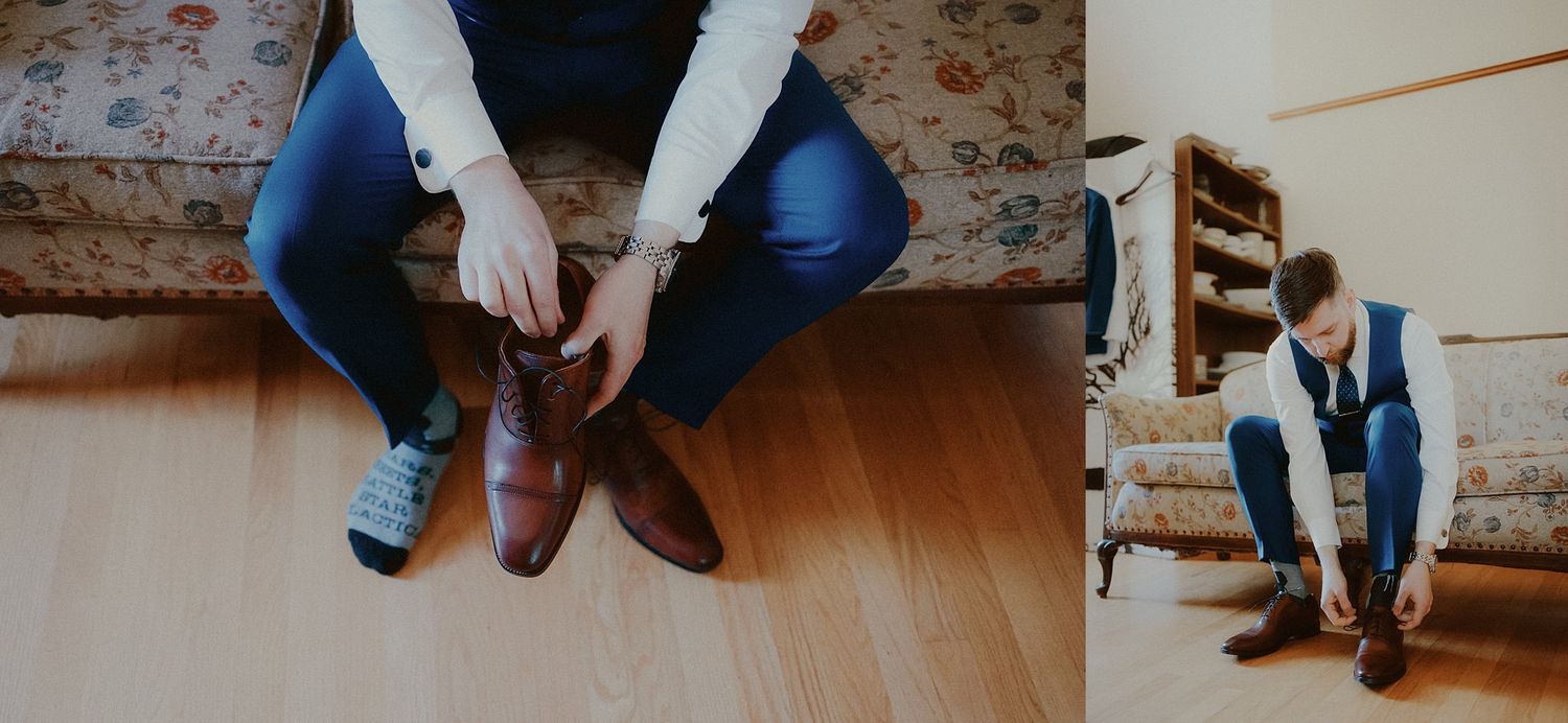 Detail shot of blue jeans and brown leather boots on a hardwood floor.