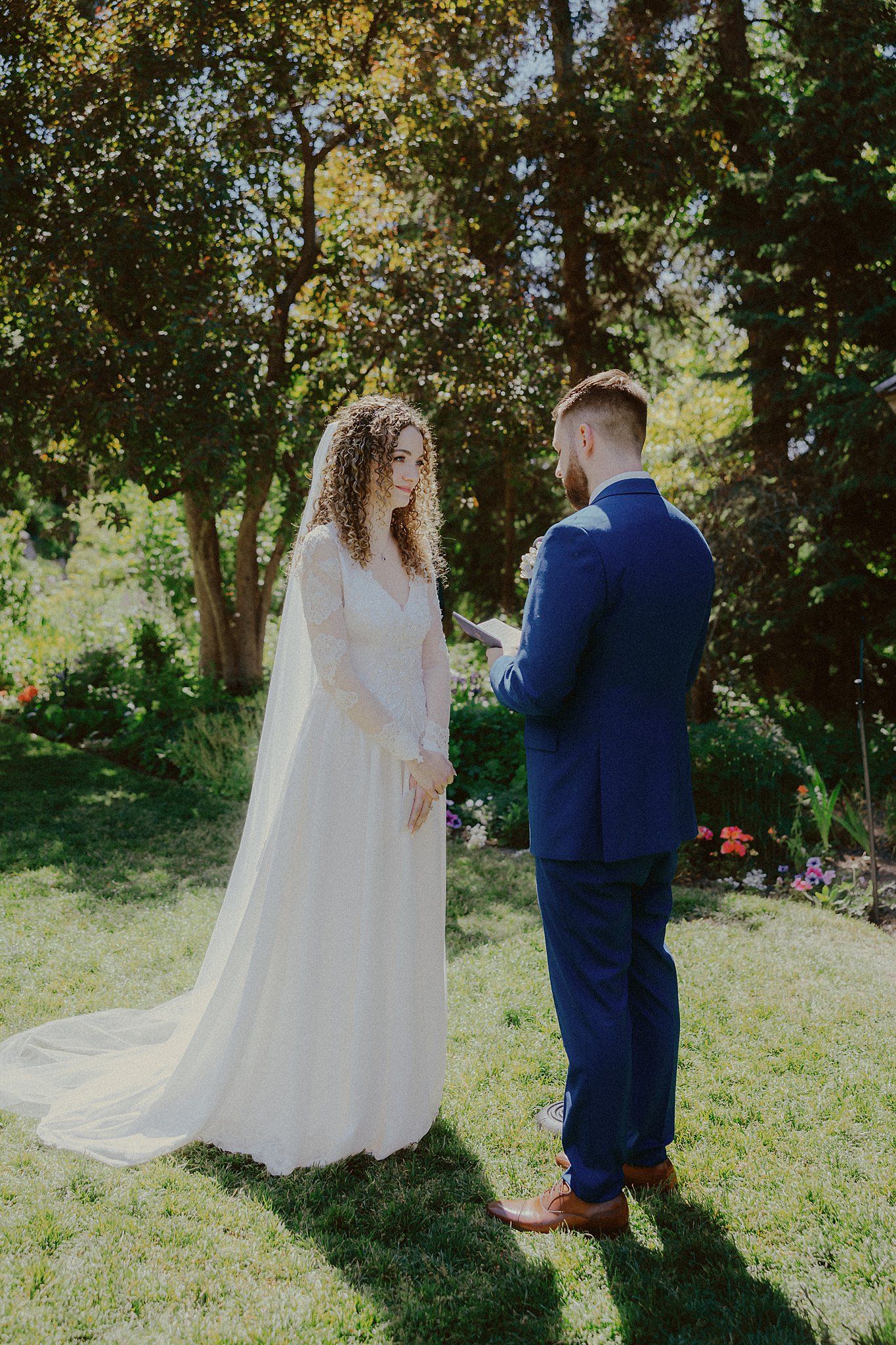 A series of romantic wedding portraits taken in a lush garden setting.