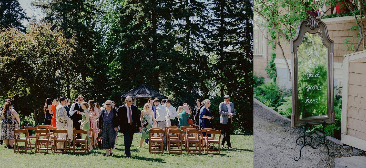 An outdoor wedding ceremony setup with wooden chairs and guests gathered in a garden setting.