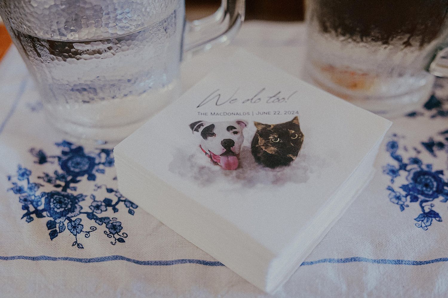 Blue and white decorative details on delicate wedding table settings.