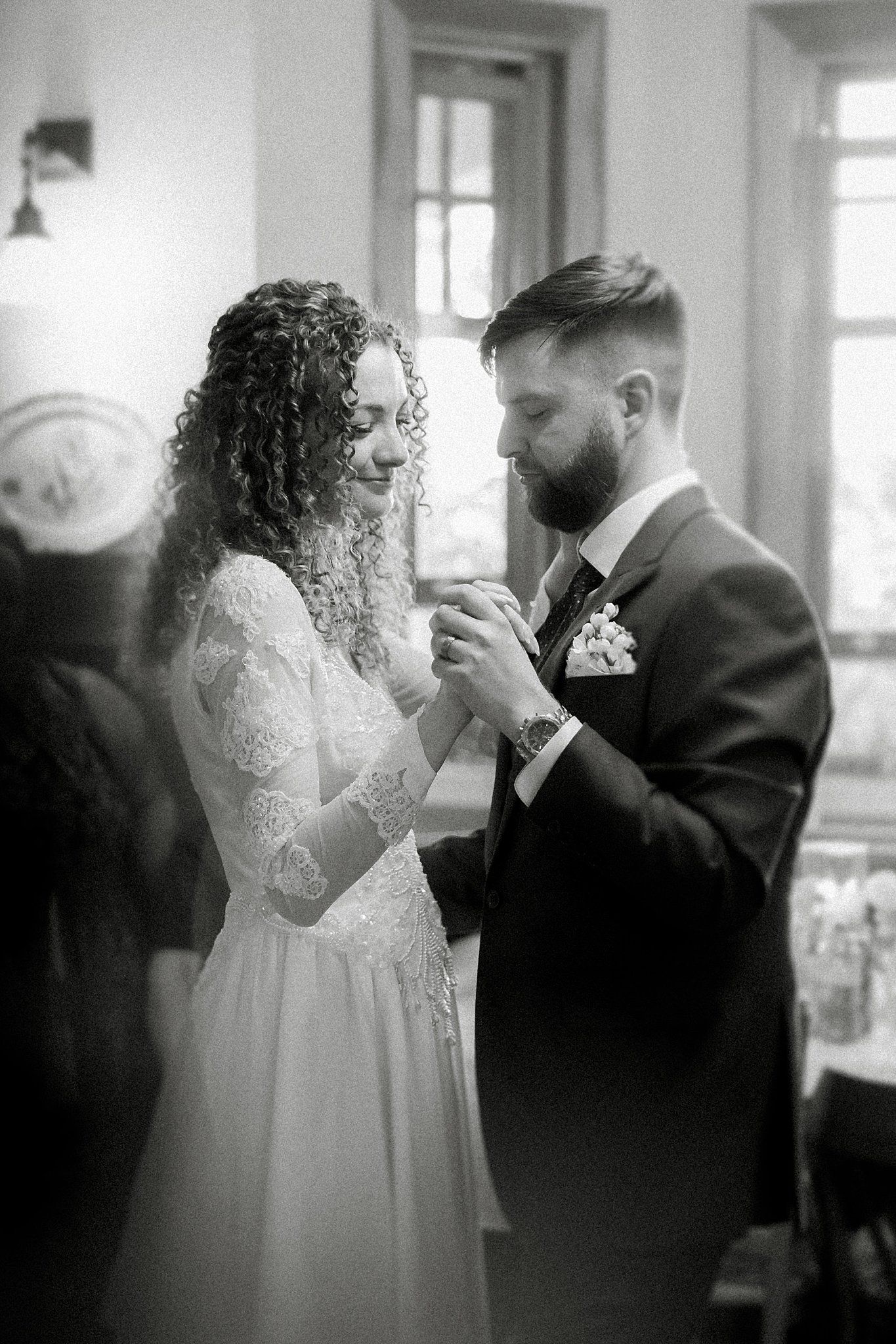 A romantic black and white wedding dance sequence showing tender moments between a couple.
