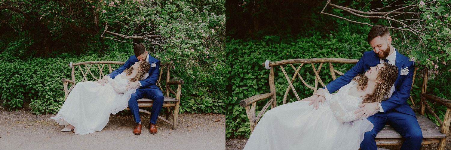 Wedding couple sharing intimate moments along a tree-lined garden path.