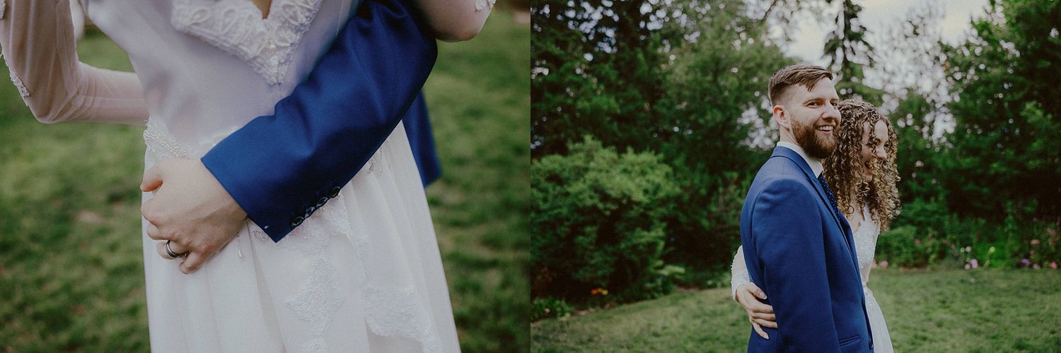 Wedding couple sharing tender moments outdoors among green foliage and natural scenery.