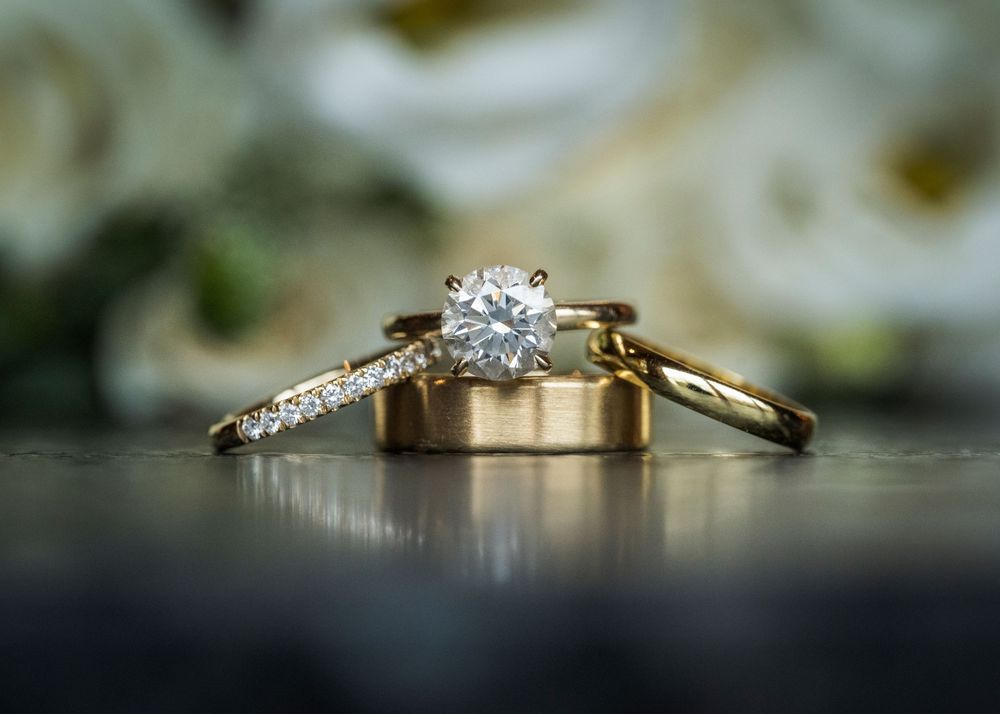 Close-up macro shots of elegant diamond wedding rings and bands with sparkly details.