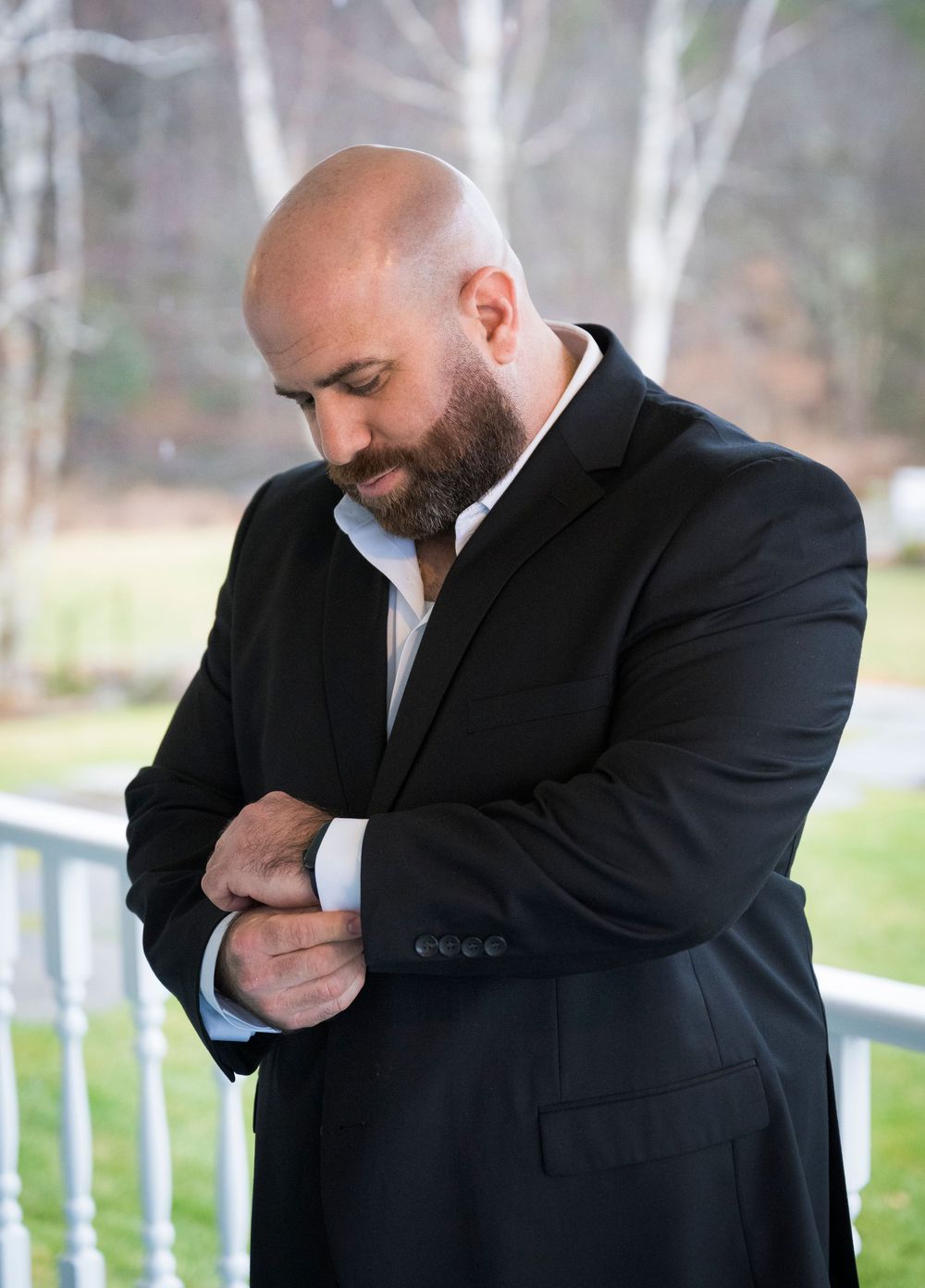 A series of emotional moments showing a man in a black suit wiping tears from his eyes.