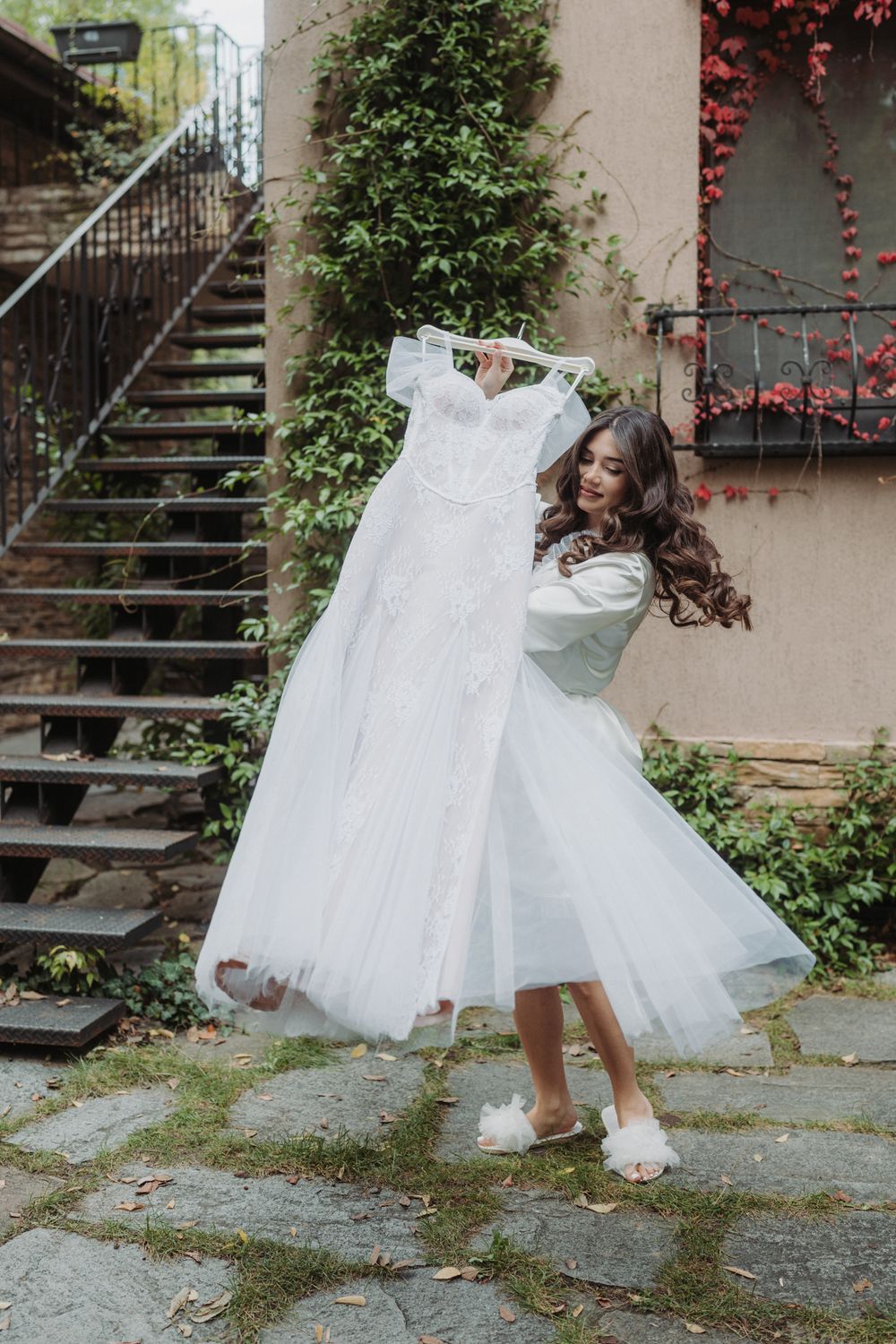 A white wedding dress with a full tulle skirt twirls gracefully in a series of dynamic outdoor photos.