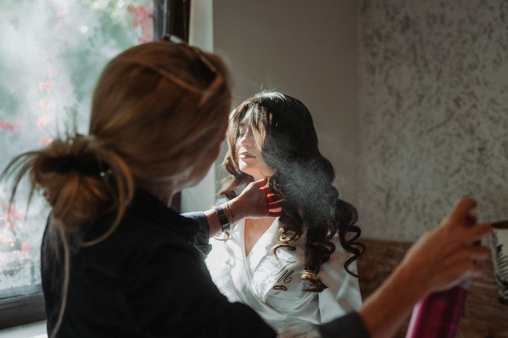 A sequence of candid moments shows a hairstylist working on a client's hair in a salon setting.