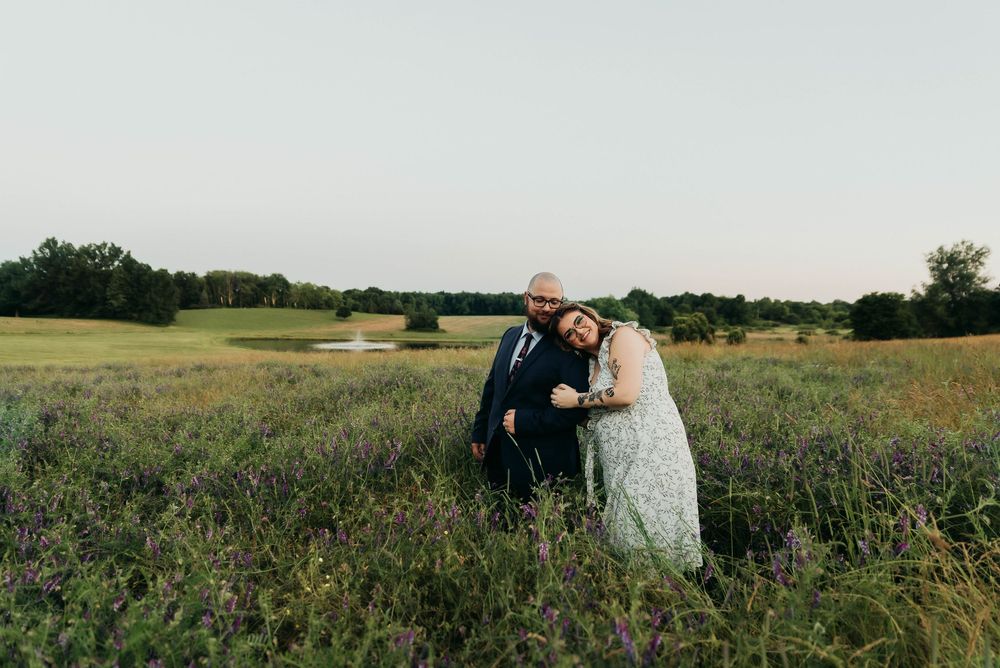 Series of romantic poses in a vast open field with natural lighting.