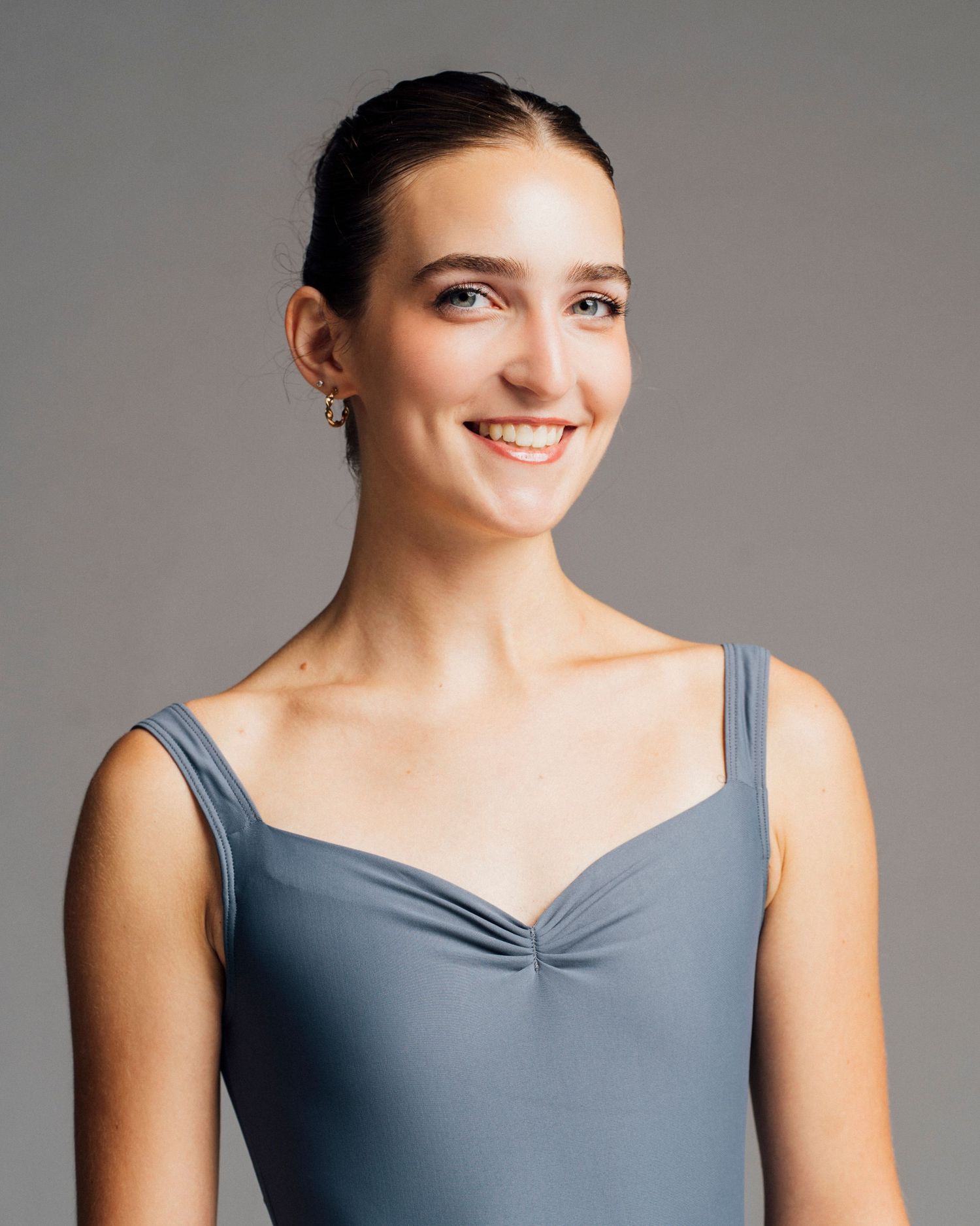 Professional Chicago dance audition headshot with soft lighting and minimalist background summer intensive