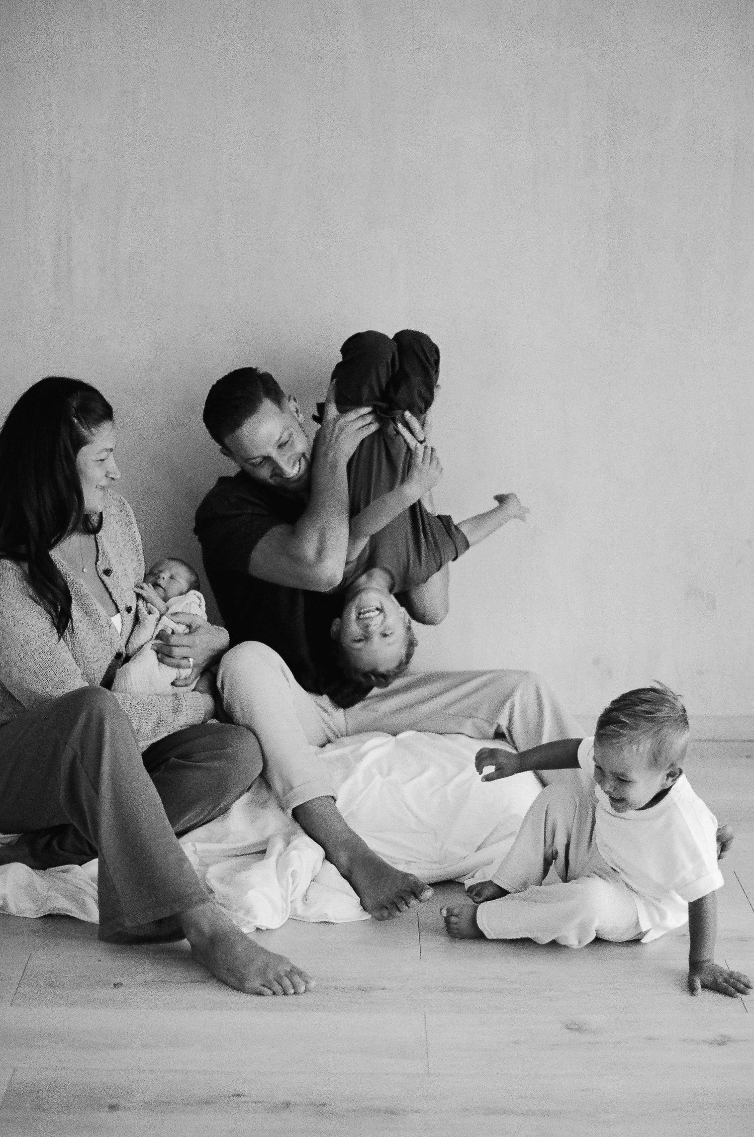 Family studio photoshoot in California with joyful candid moments