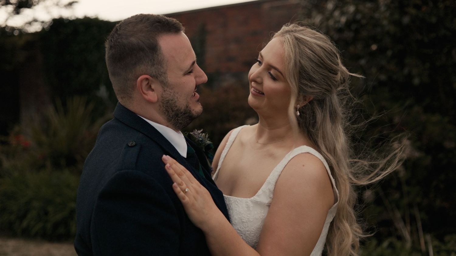North West Castle Hotel wedding with bride hugging groom.