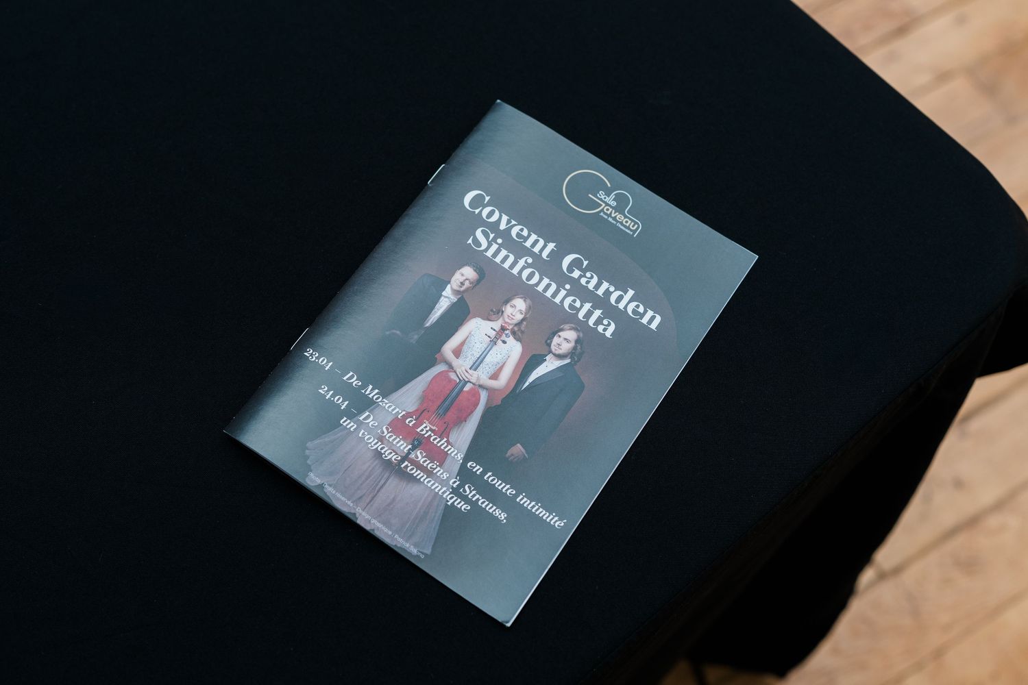 Covent Garden Sinfonietta program booklet displayed on a black table at a classical music event.