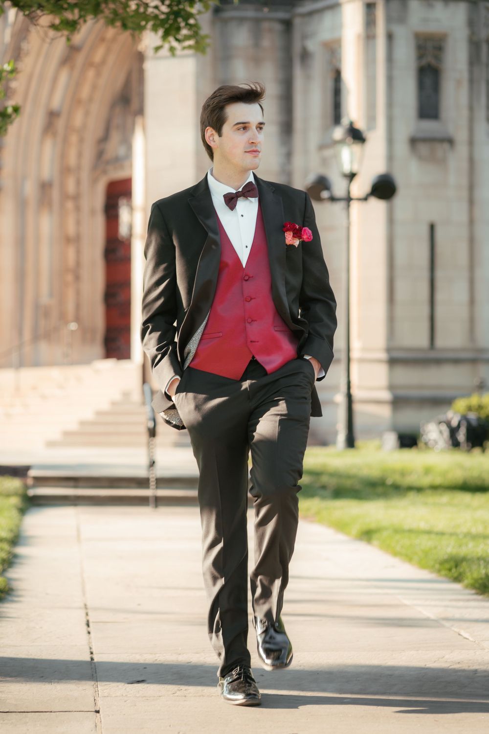 Groom walking outdoors before the wedding ceremony at Heinz Chapel.