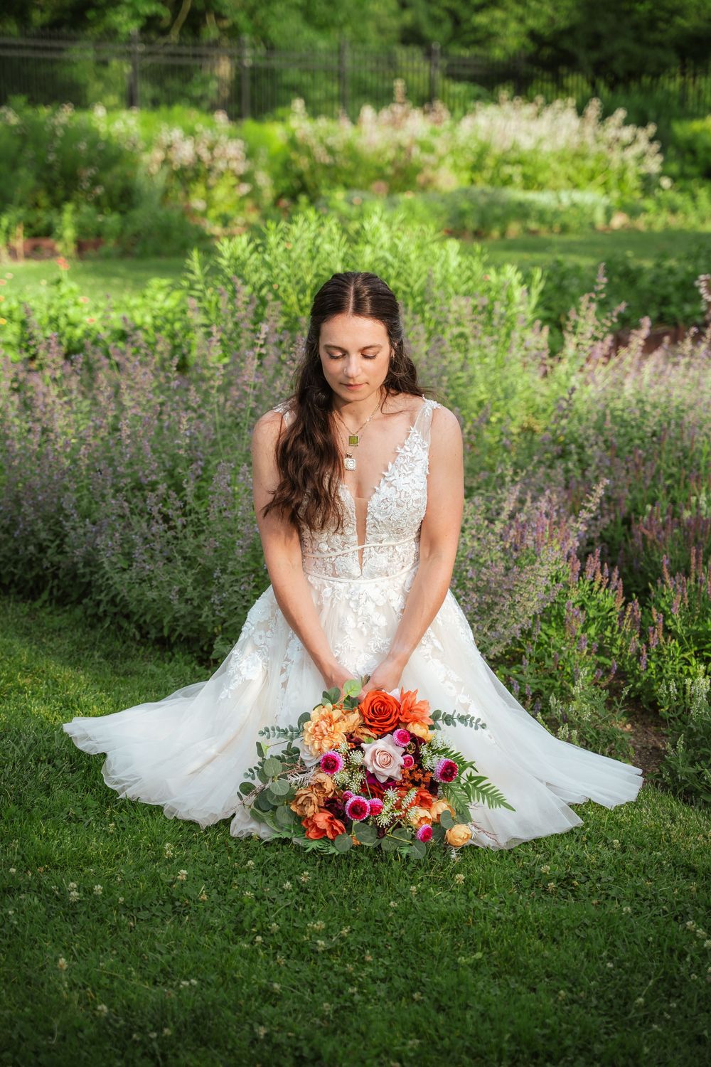Bride sitting down with a bouquet in her lap