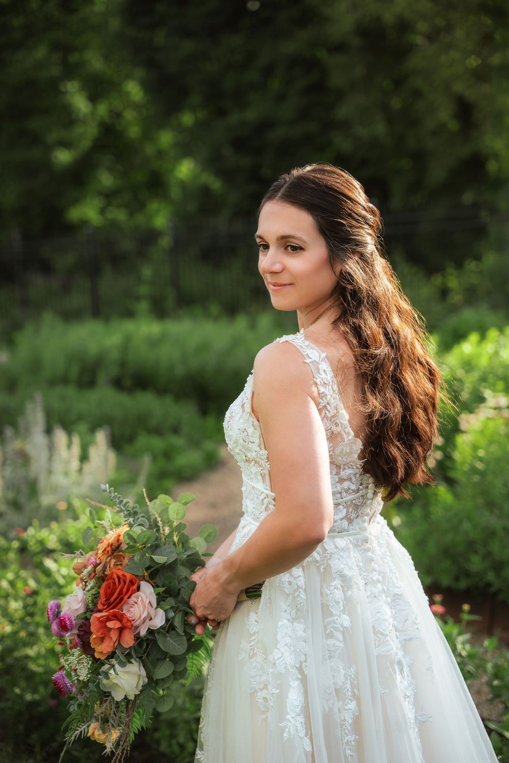 Bride looking over her shoulder during an outdoor bridal portrait at Hartwood Acres.