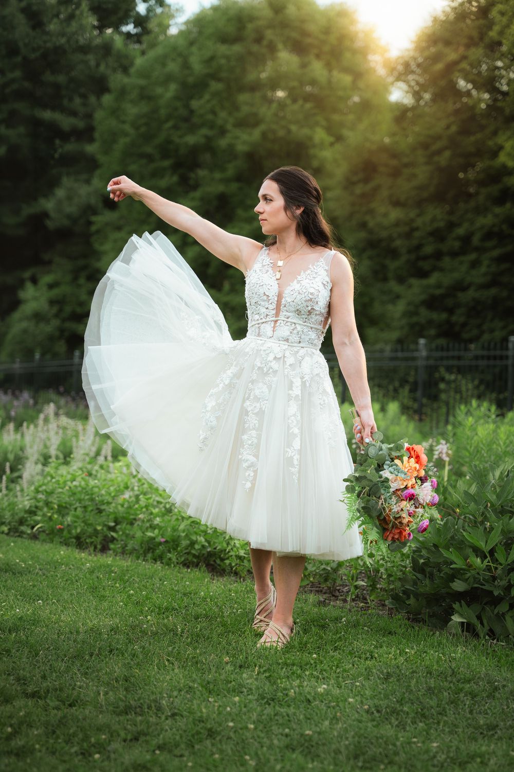 Bride twirling in her wedding dress during golden hour bridal portraits at Hartwood Acres.