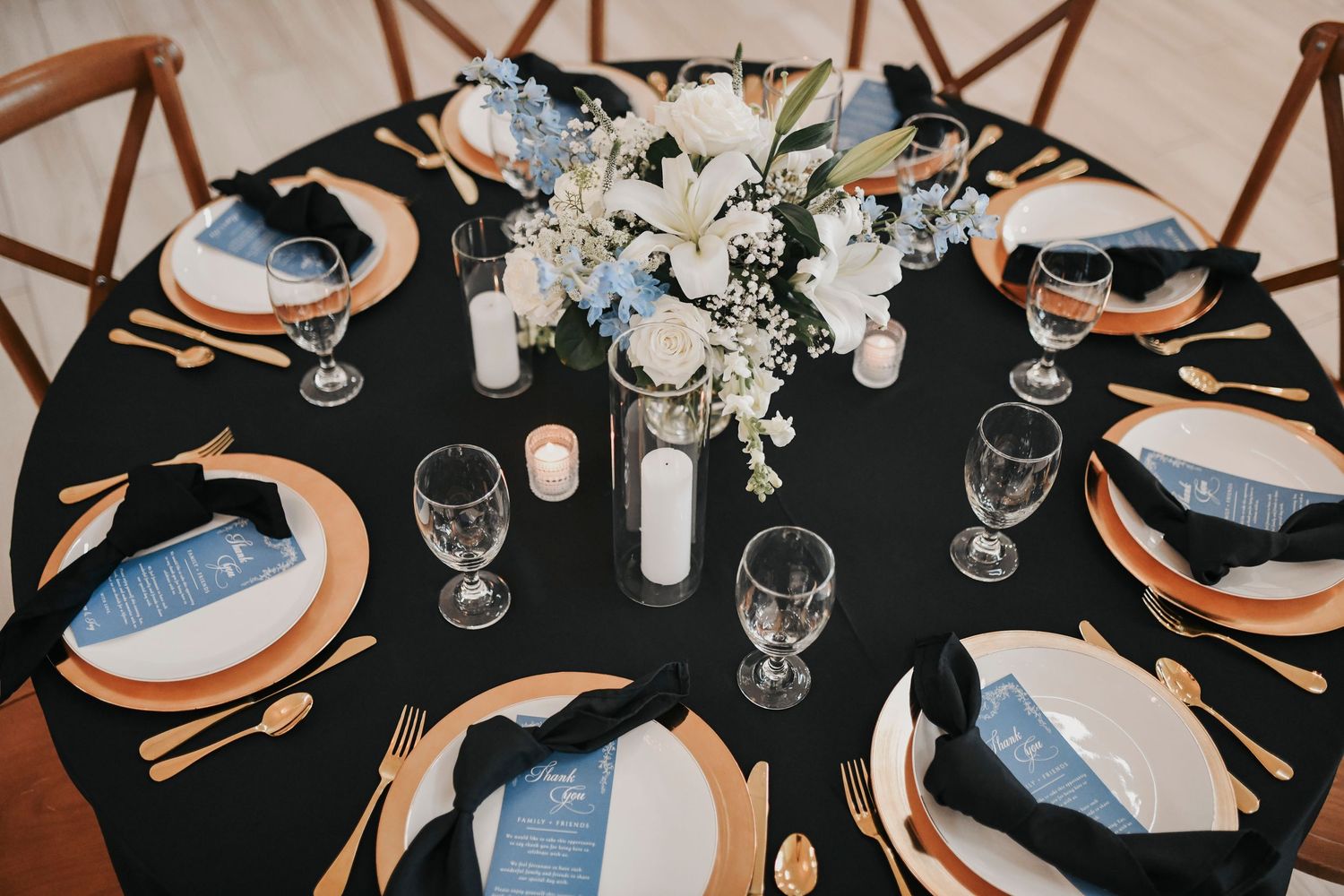 Romantic candlelit wedding reception with white roses and baby's breath