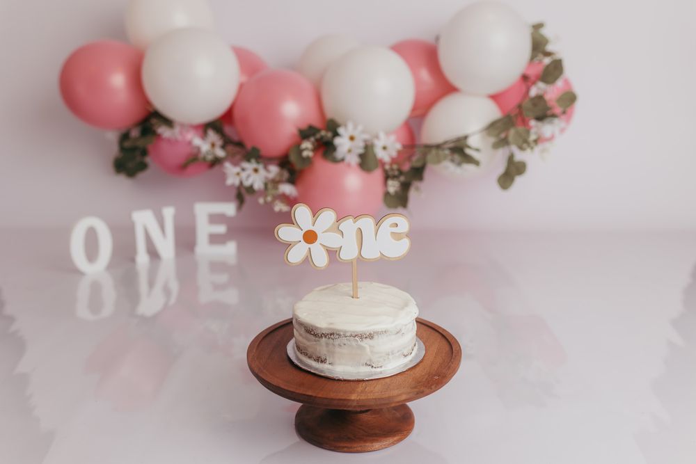 Studio cake smash set up to capture baby's photos to celebrate her turning one.