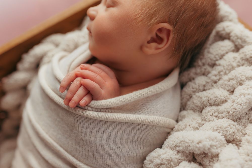 close up detail photo of a newborns hands.