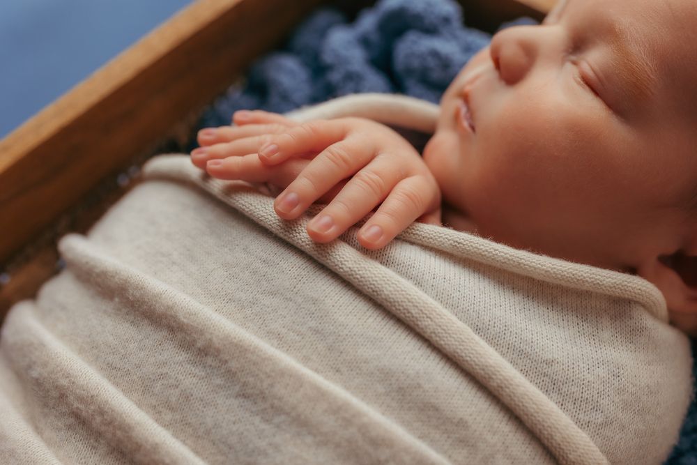 Detail photo of a newborn babies hands.